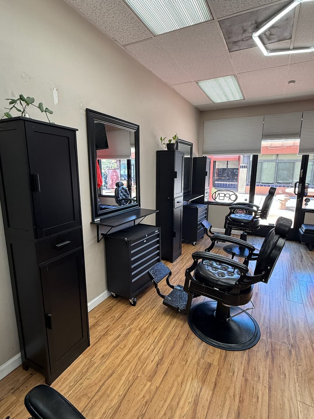 Modern barber chair and styling station inside Zion Salon & Barber Shop in National City, California.